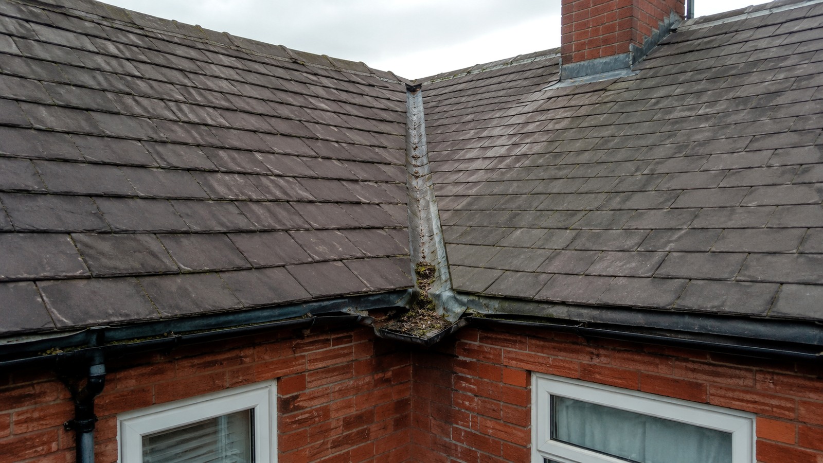 Older pitched roof and masonry representative of Bolton housing